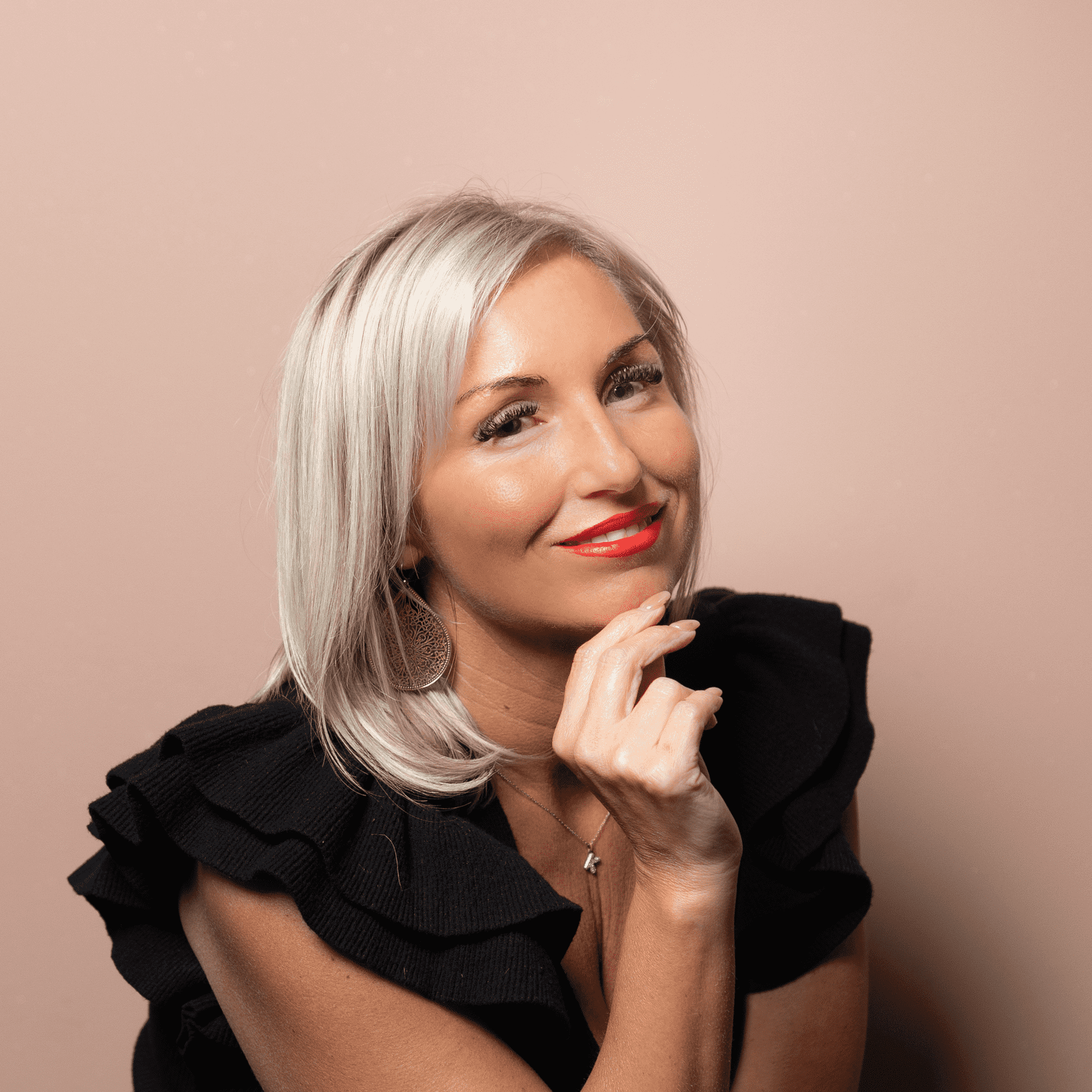 Portrait of Kristy B, a professional stylist at Buffalo Glam Salon, showcasing their expertise and style.
