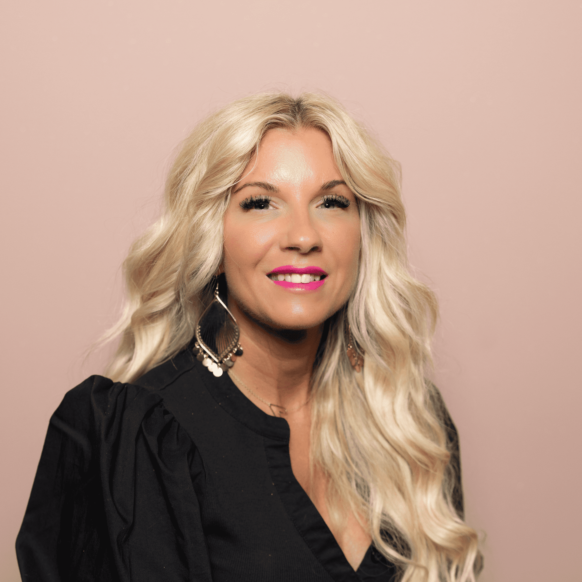 Portrait of Jessie Wylie, a professional stylist at Buffalo Glam Salon, showcasing their expertise and style.