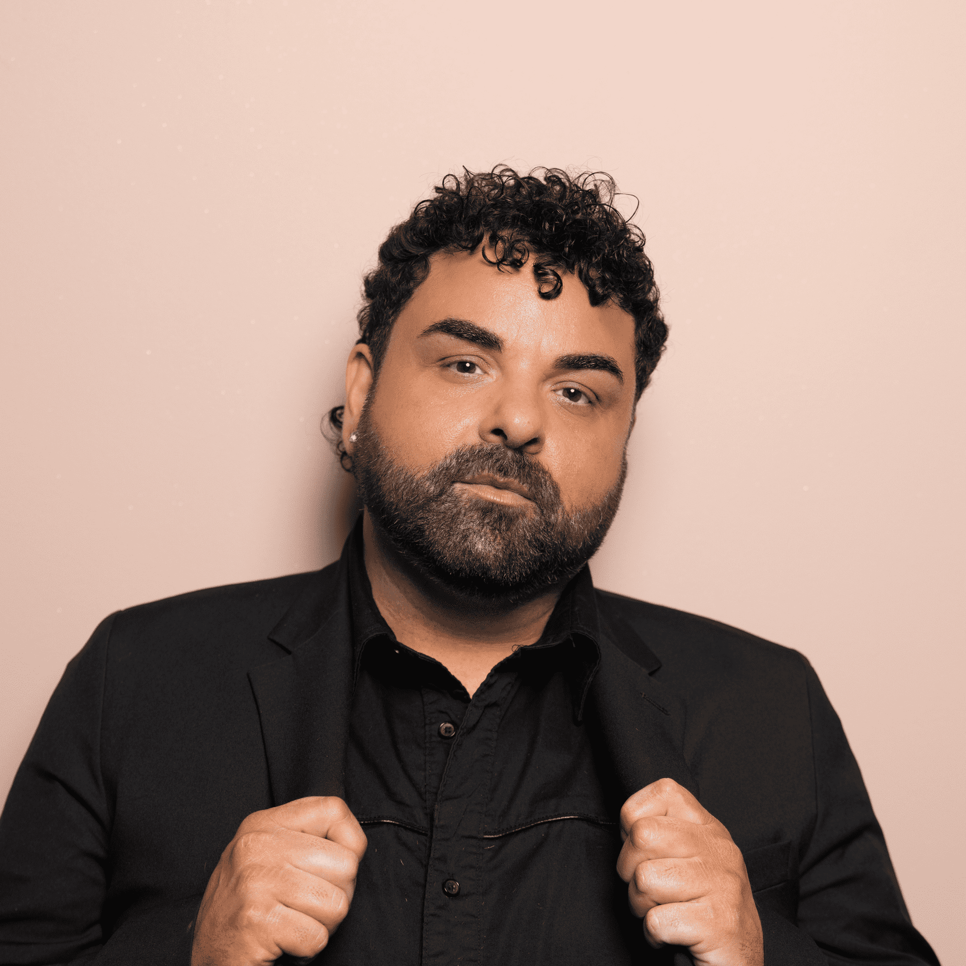 Portrait of Calogero (Charlie) Farruggio, a professional stylist at Buffalo Glam Salon, showcasing their expertise and style.