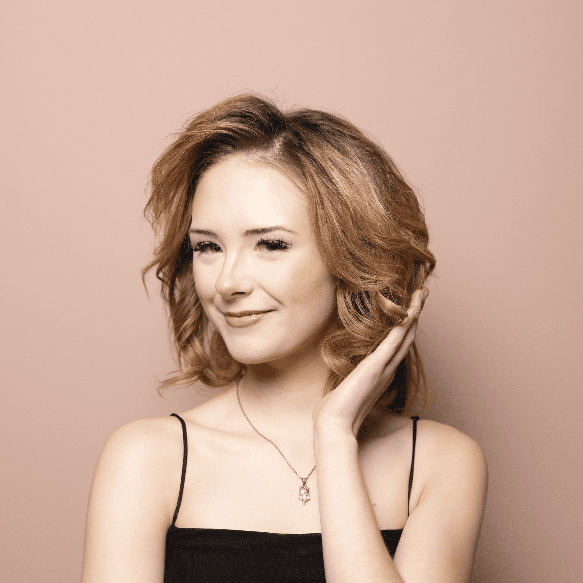 Portrait of Nina, a professional stylist at Buffalo Glam Salon, showcasing their expertise and style.