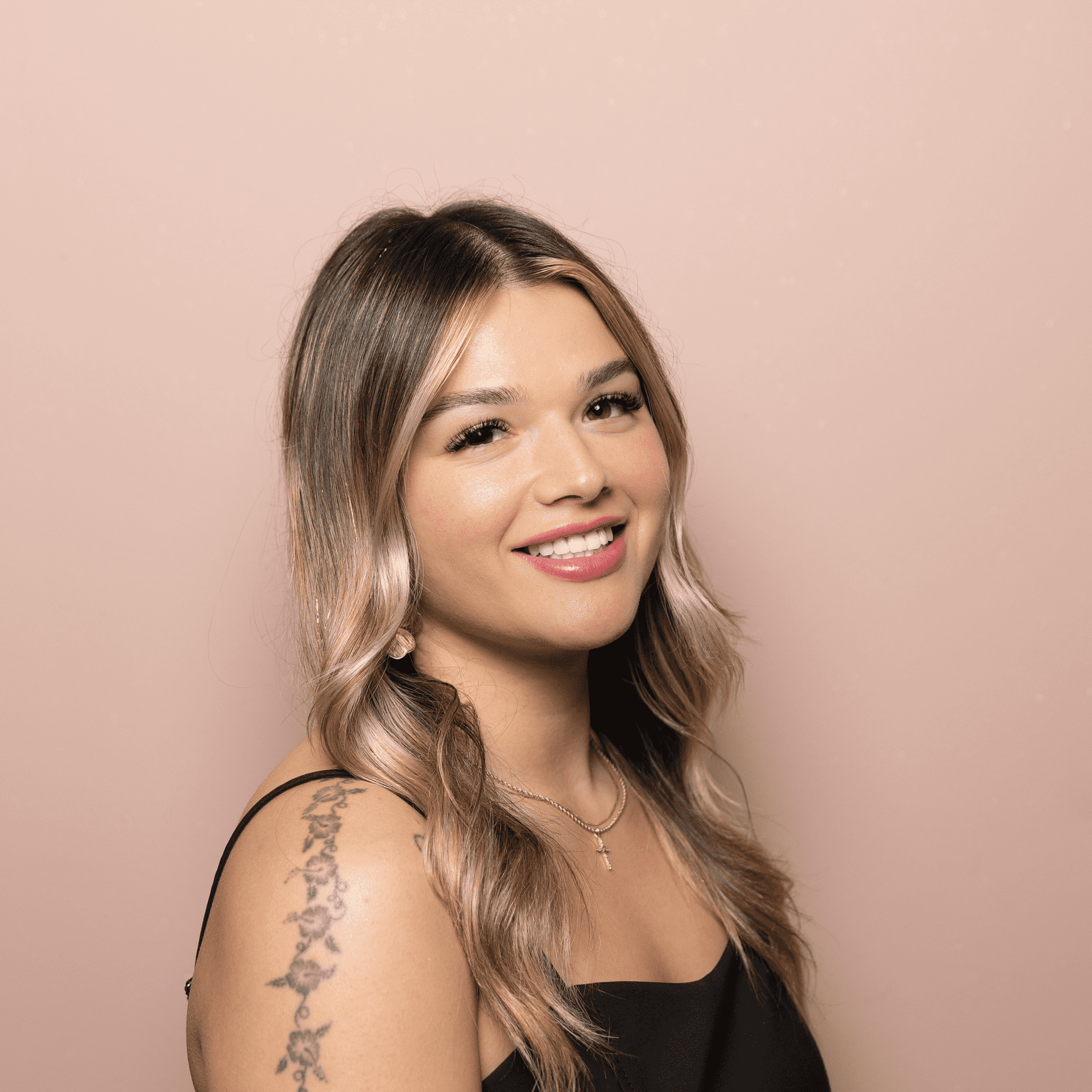 Portrait of Jada Jamieson, a professional stylist at Buffalo Glam Salon, showcasing their expertise and style.