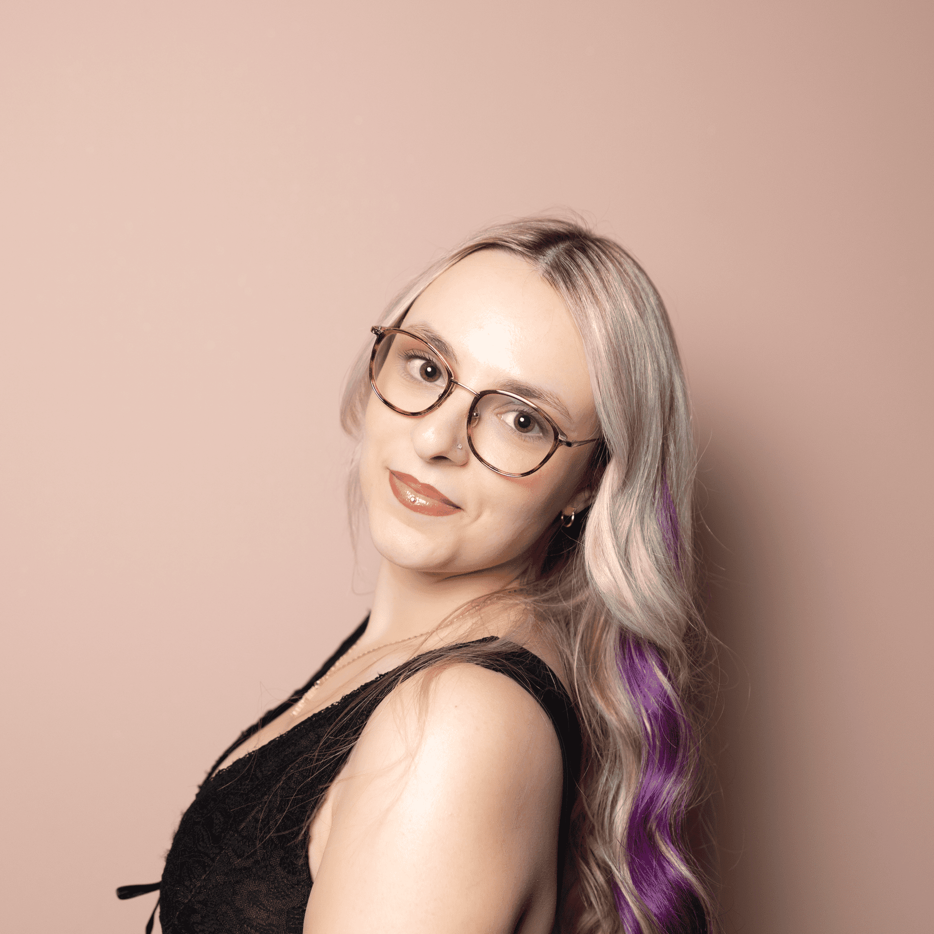 Portrait of Alyssa Mammana, a professional stylist at Buffalo Glam Salon, showcasing their expertise and style.