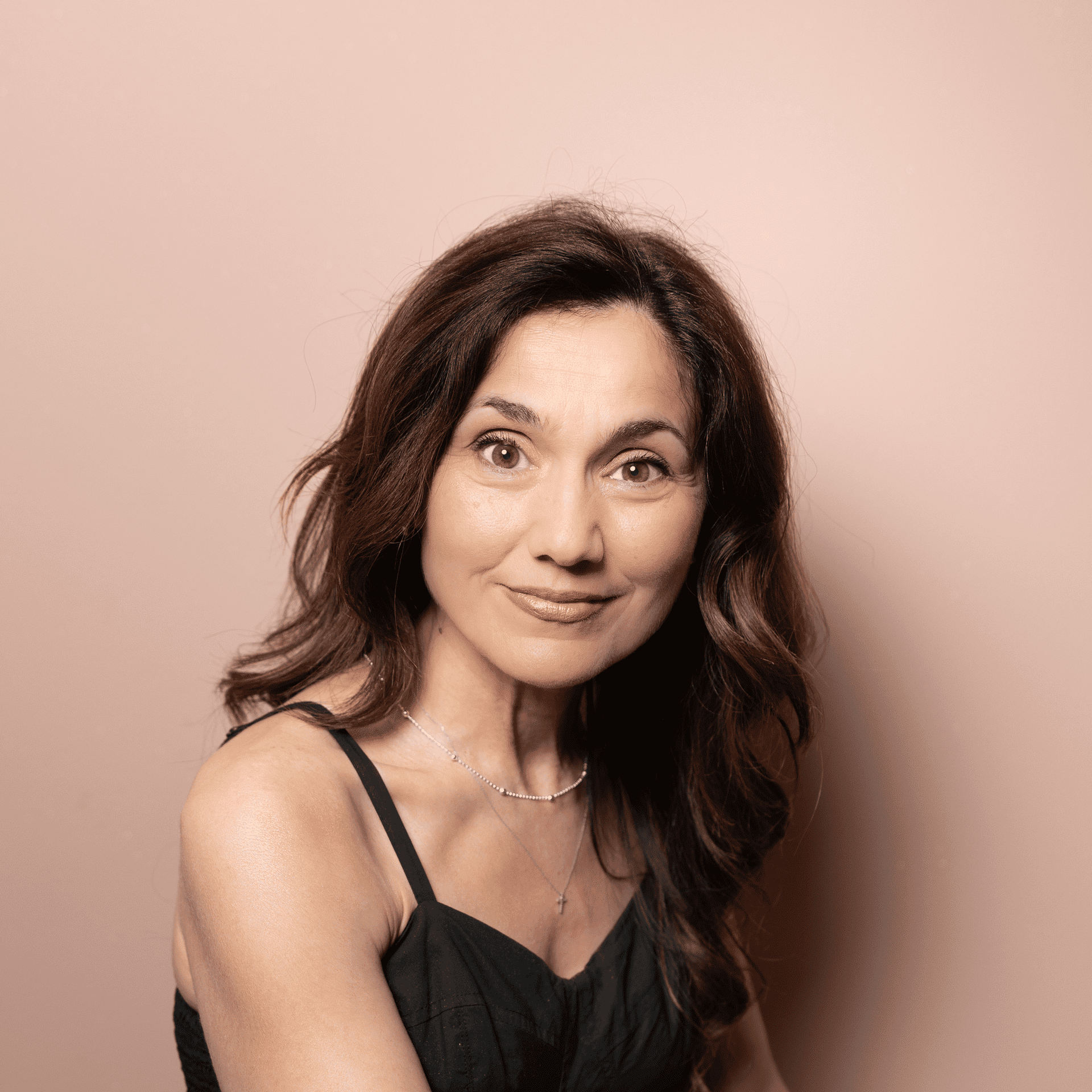 Portrait of Karina Grigoryan, a professional stylist at Buffalo Glam Salon, showcasing their expertise and style.