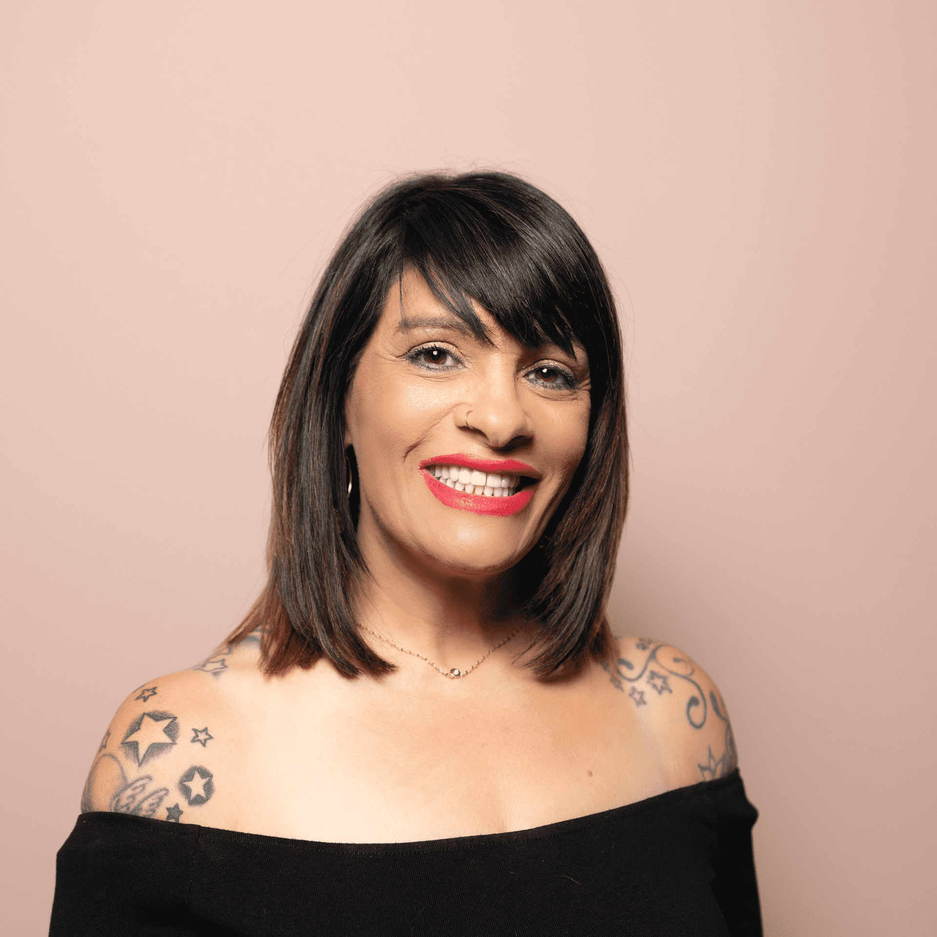 Portrait of Heidi Jamieson, a professional stylist at Buffalo Glam Salon, showcasing their expertise and style.